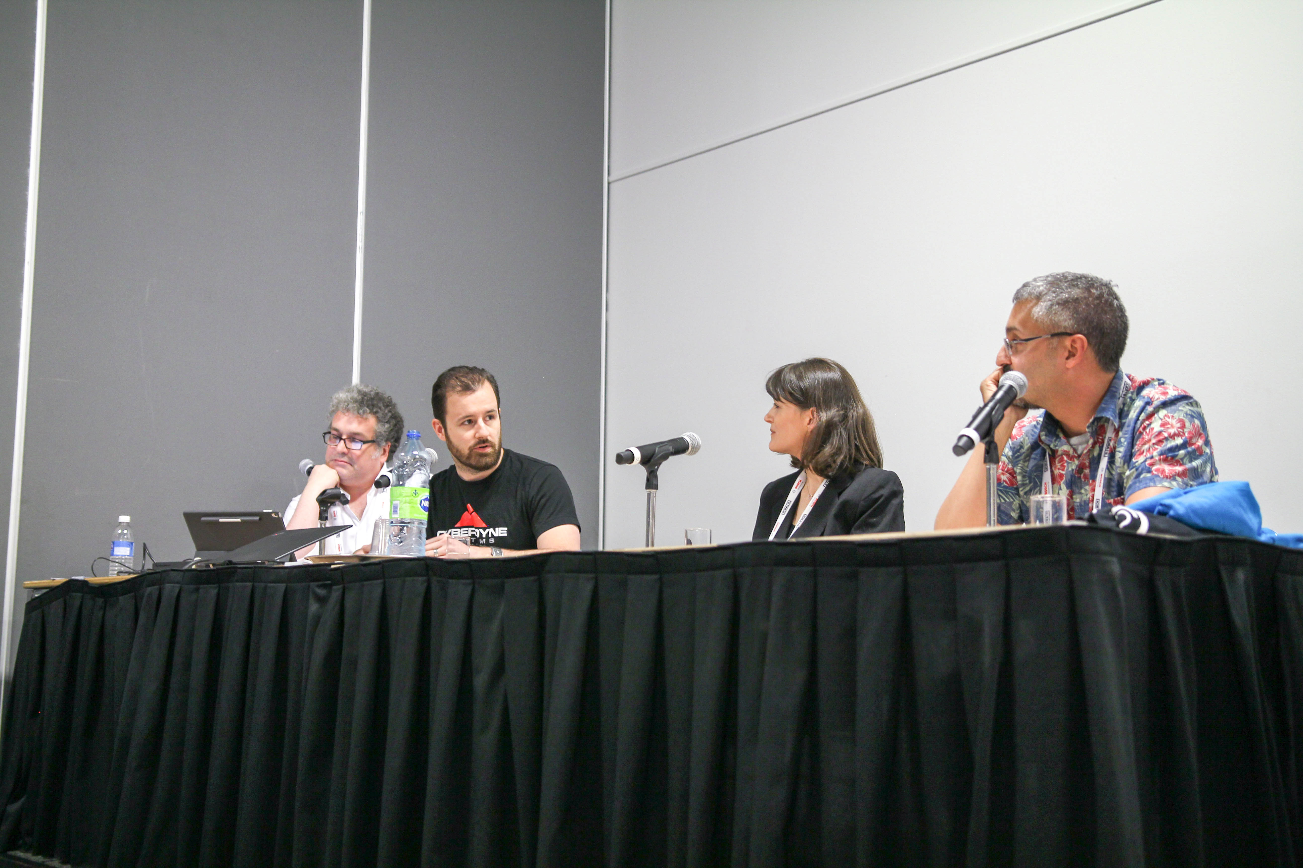 Prof. Angela Schoellig debates whether the pervasiveness of deep learning in robotics research is an impediment to gaining scientific insights into robotics problems, with Oliver Brock (TU Berlin), Ryan Gariepy (Clearpath Robotics), and Nick Roy (MIT) at the ICRA 2019. Photo courtesy Lee Clement. 