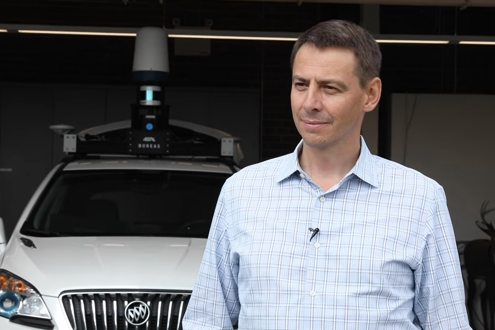 Steve Waslander in front of Autonomous Vehicle